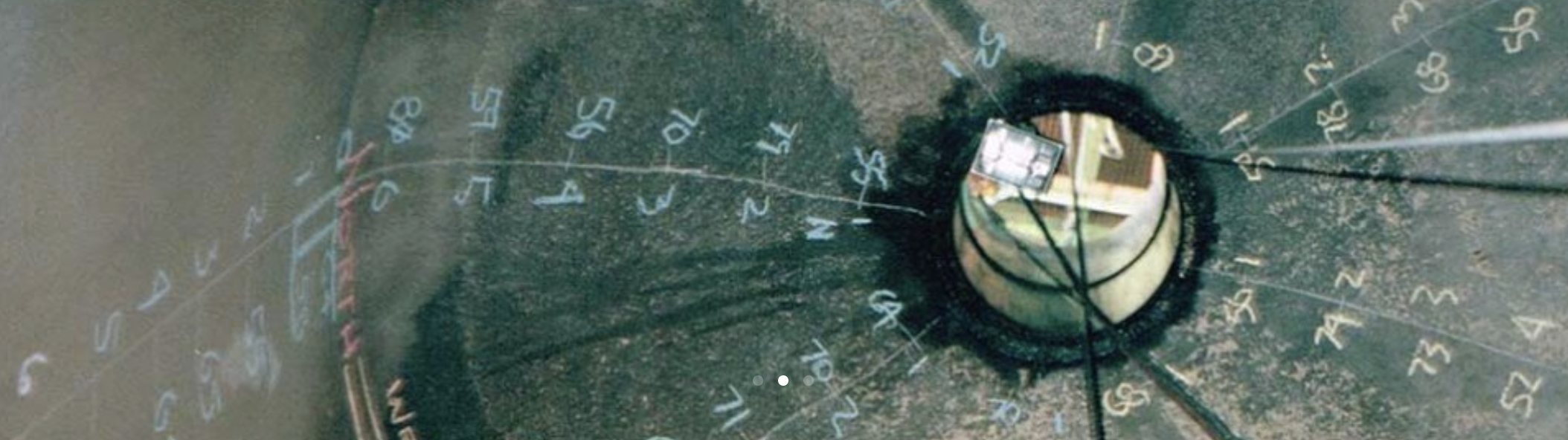 Interior wall of a digester chalked with grid numbers and ultrasonic thickness readings.